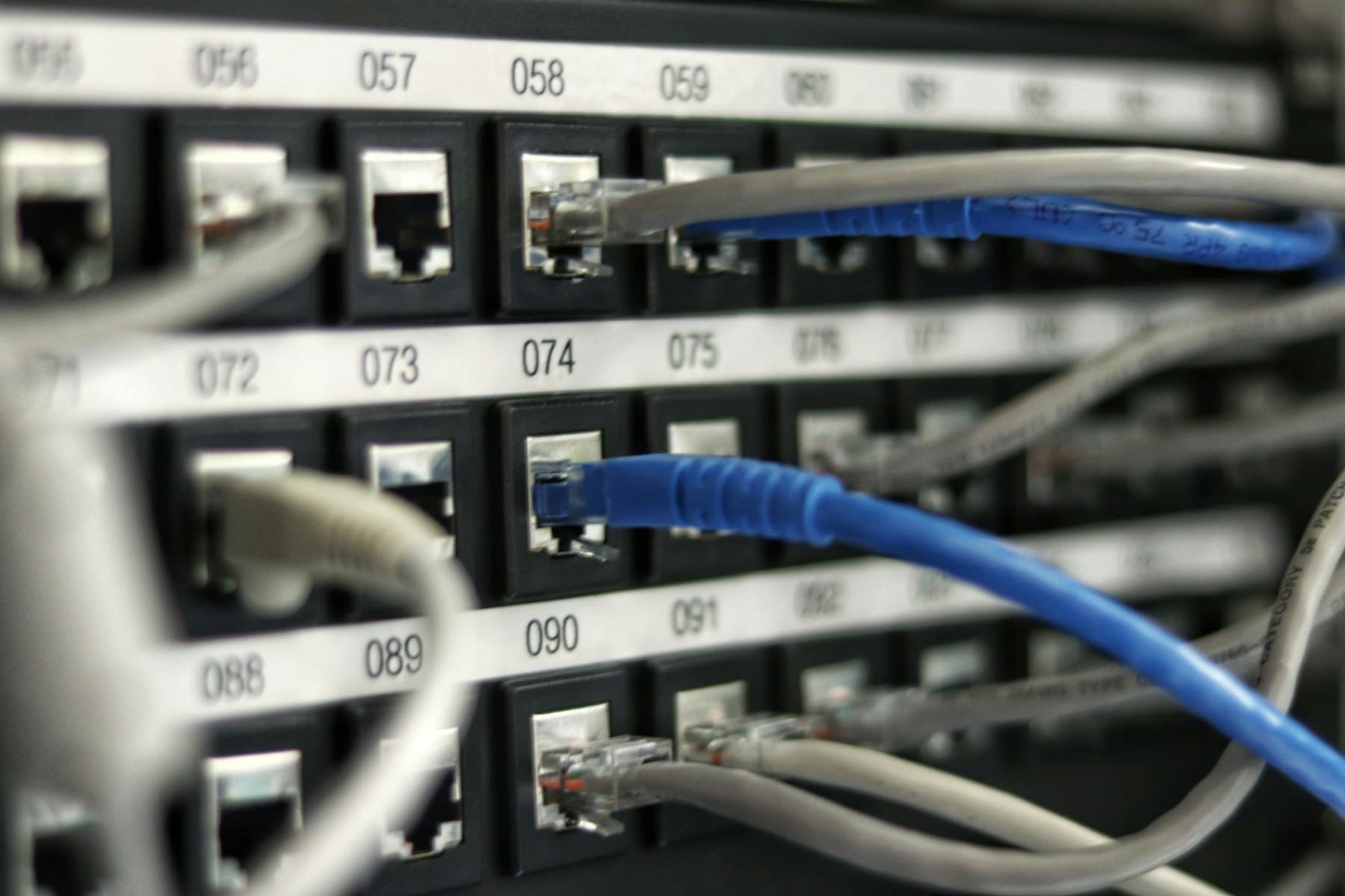 Network patch panel with connected ethernet cables